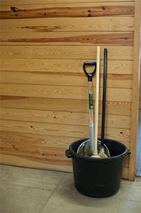 Cleaning supplies in a bucket